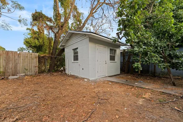 a house with a tree in front of it