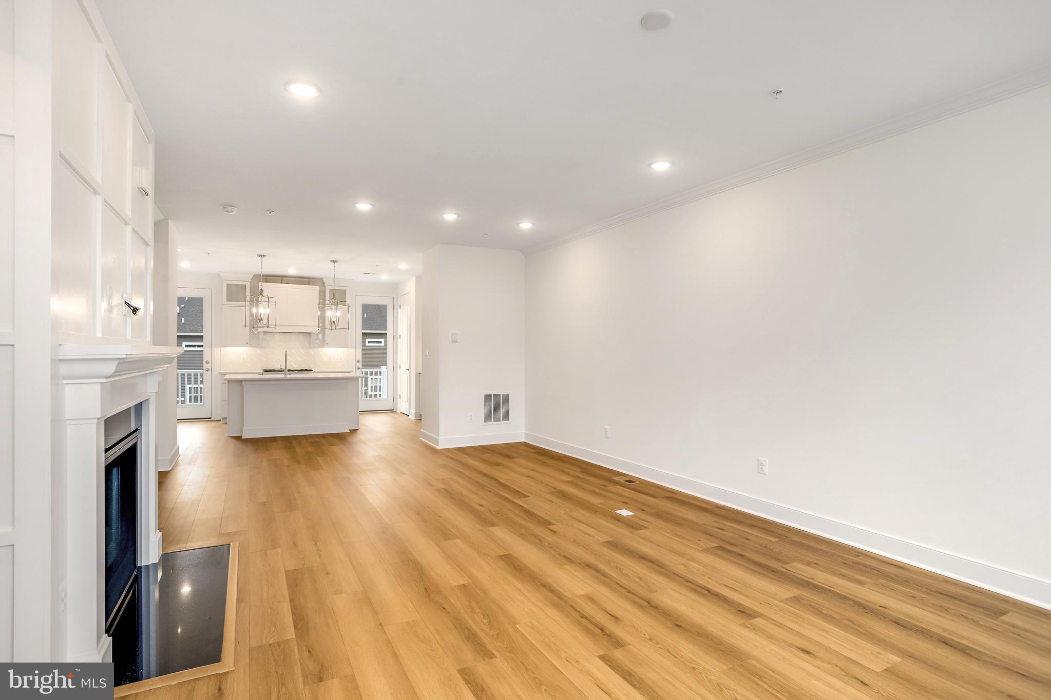 1885 Shookstown Road Frederick, MD 21702 - Photo 26 of 47 a view of kitchen and hall with wooden floor