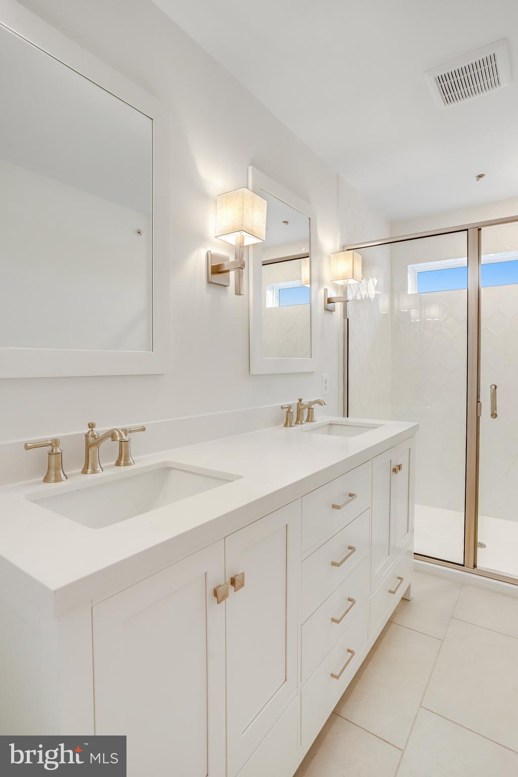 1885 Shookstown Road Frederick, MD 21702 - Photo 35 of 47 a bathroom with double sink and a mirror