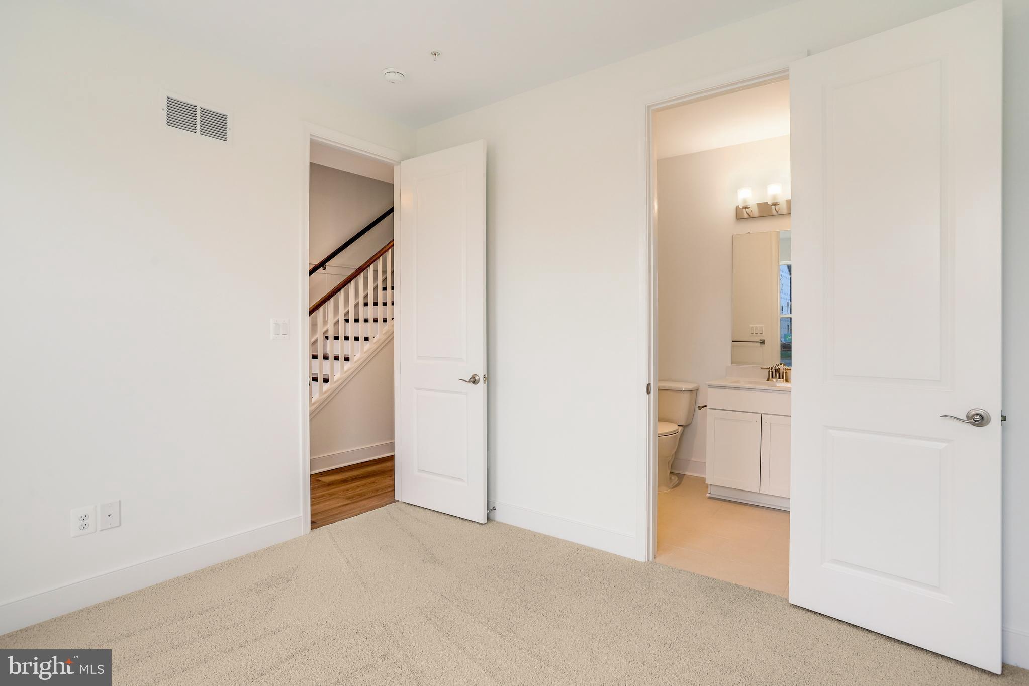1885 Shookstown Road Frederick, MD 21702 - Photo 7 of 47 a view of hallway with stairs and a bathroom