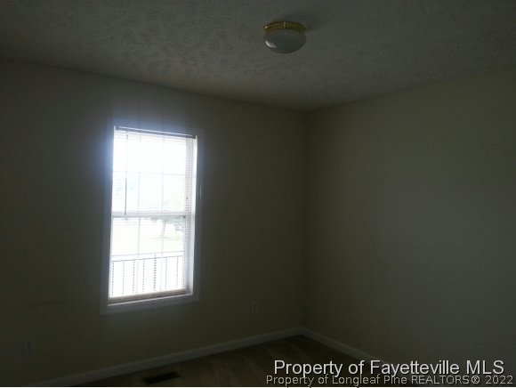 513 Kernstown Road Raeford, NC 28376 - Photo 13 of 24 an empty room with a window