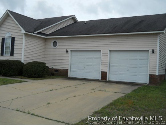 513 Kernstown Road Raeford, NC 28376 - Photo 16 of 24 a view of a house with a garage