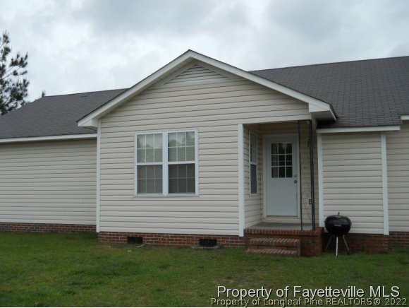 513 Kernstown Road Raeford, NC 28376 - Photo 18 of 24 a front view of a house with a yard