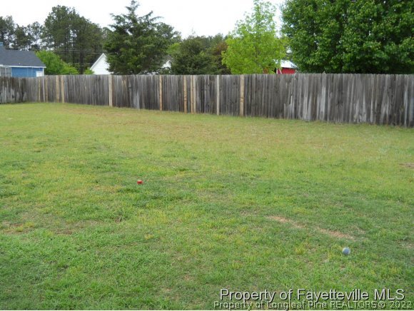 513 Kernstown Road Raeford, NC 28376 - Photo 19 of 24 a bathroom with a small yard and wooden fence