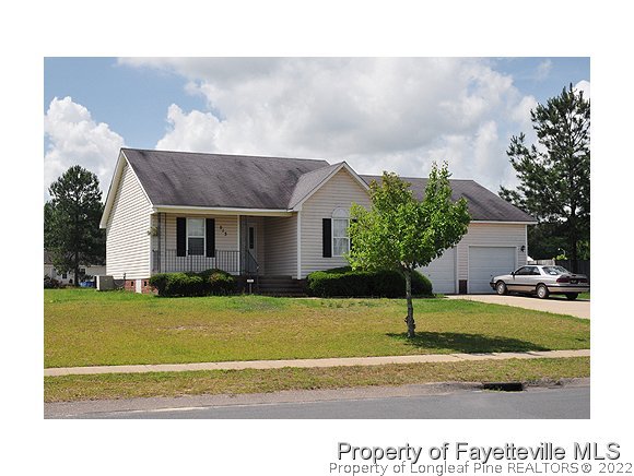 513 Kernstown Road Raeford, NC 28376 - Photo 24 of 24 a view of a house with swimming pool and a yard