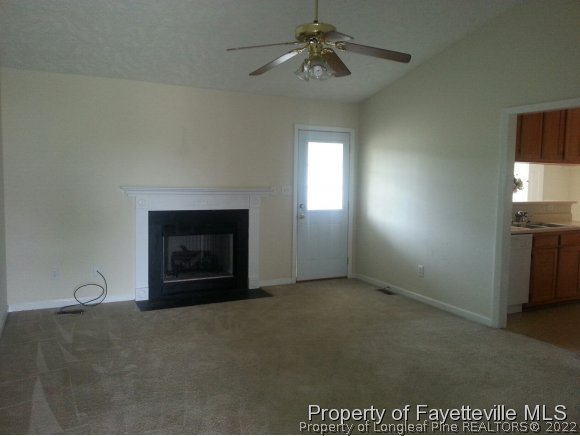 513 Kernstown Road Raeford, NC 28376 - Photo 3 of 24 a view of empty room with fireplace