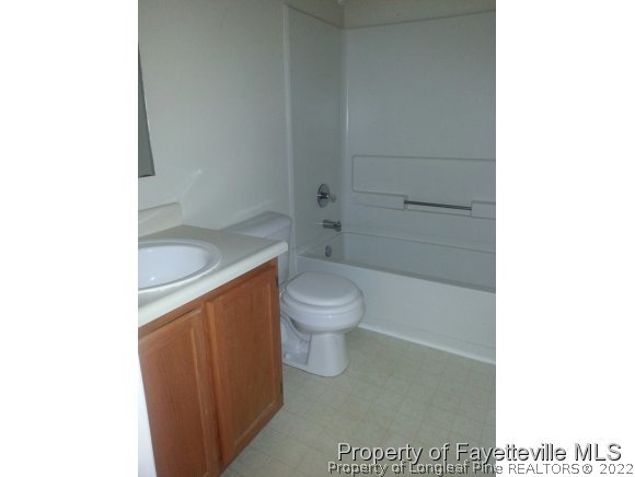 513 Kernstown Road Raeford, NC 28376 - Photo 8 of 24 a bathroom with a granite countertop toilet and a sink