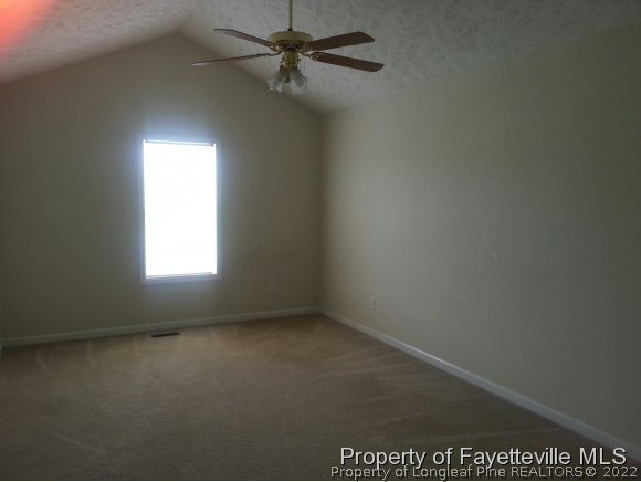 513 Kernstown Road Raeford, NC 28376 - Photo 9 of 24 an empty room with a window and a fan