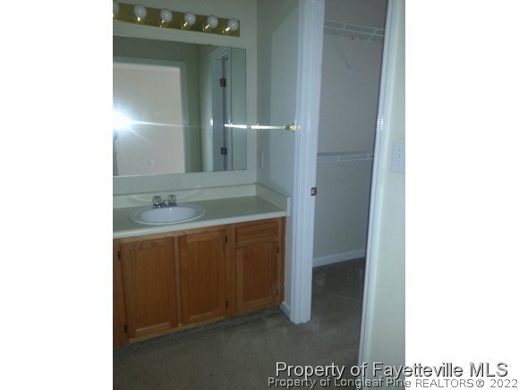 513 Kernstown Road Raeford, NC 28376 - Photo 10 of 24 a bathroom with a sink and a mirror