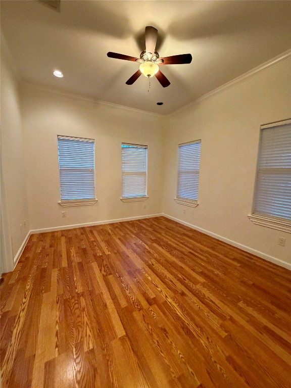 398 Mesa Drive, Unit C Del Valle, TX 78617 - Photo 16 of 21 a view of empty room with wooden floor and fan