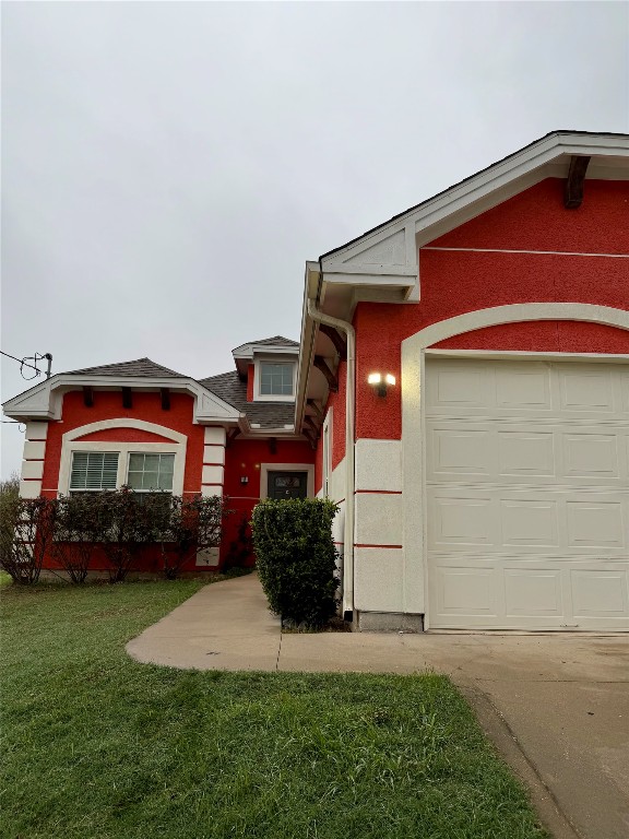 398 Mesa Drive, Unit C Del Valle, TX 78617 - Photo 3 of 21 a front view of a house with a yard