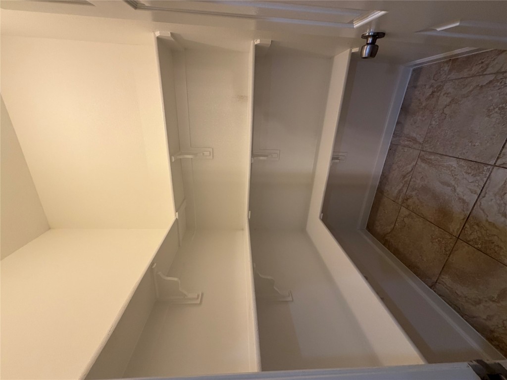 398 Mesa Drive, Unit C Del Valle, TX 78617 - Photo 8 of 21 a view of an empty walk in closet