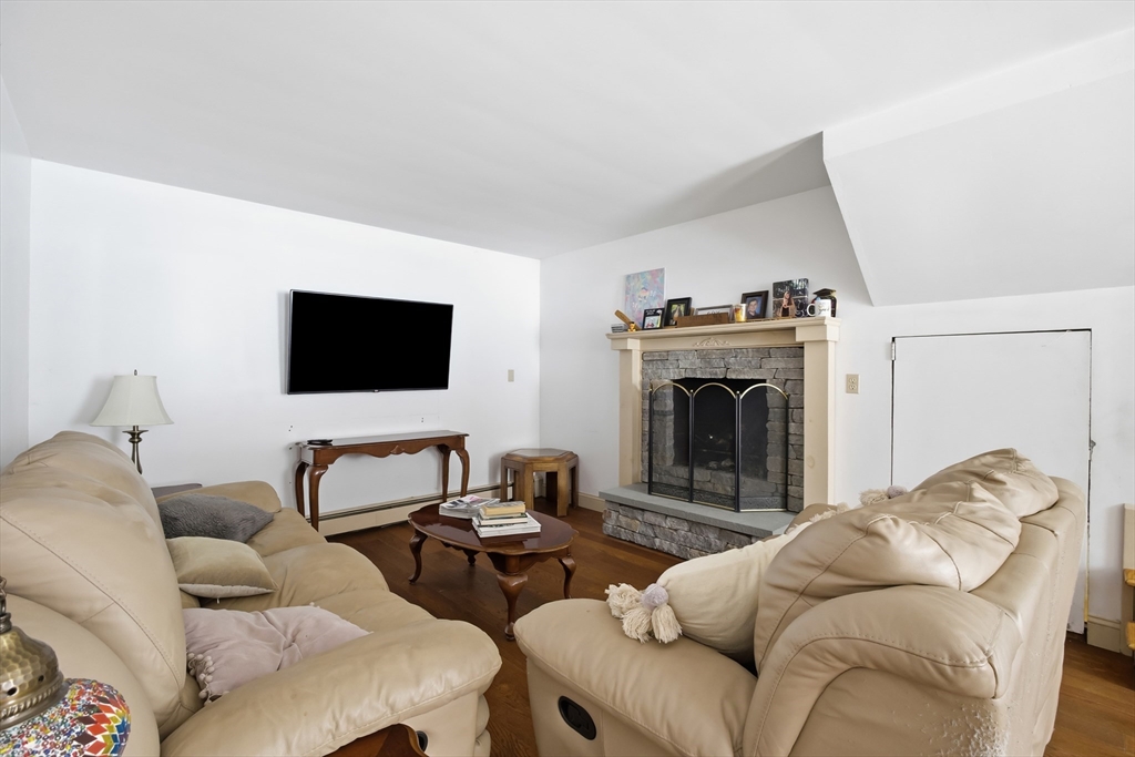 79 High Street Uxbridge, MA 01569 - Photo 13 of 35 a living room with furniture and a flat screen tv