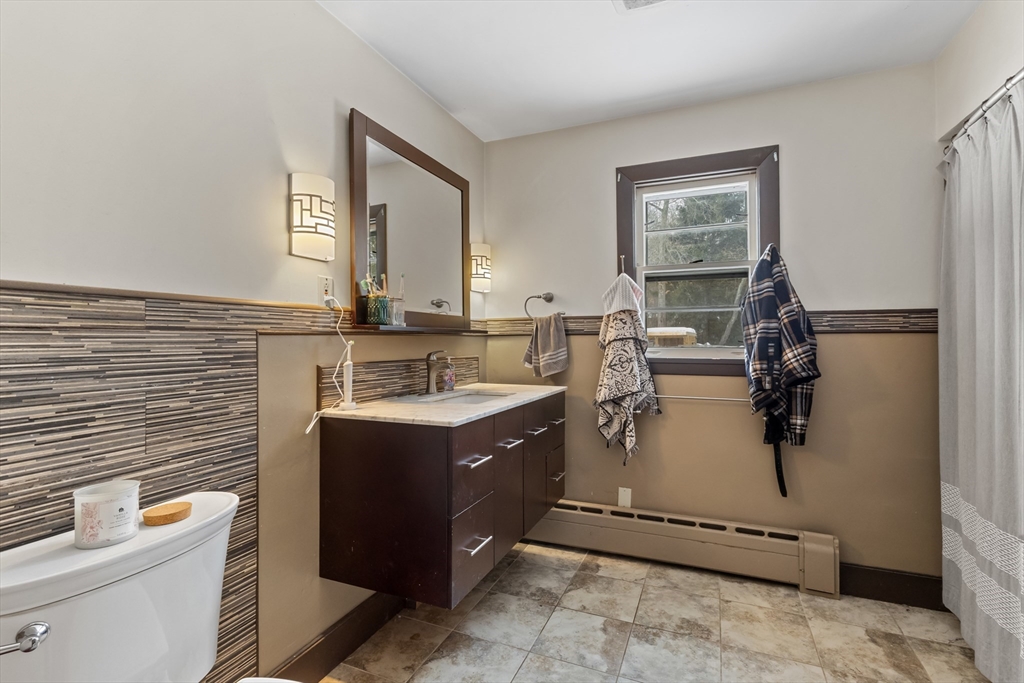 79 High Street Uxbridge, MA 01569 - Photo 14 of 35 a bathroom with a sink vanity mirror and toilet