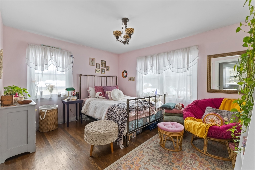 79 High Street Uxbridge, MA 01569 - Photo 16 of 35 a bedroom with a bed and a chair