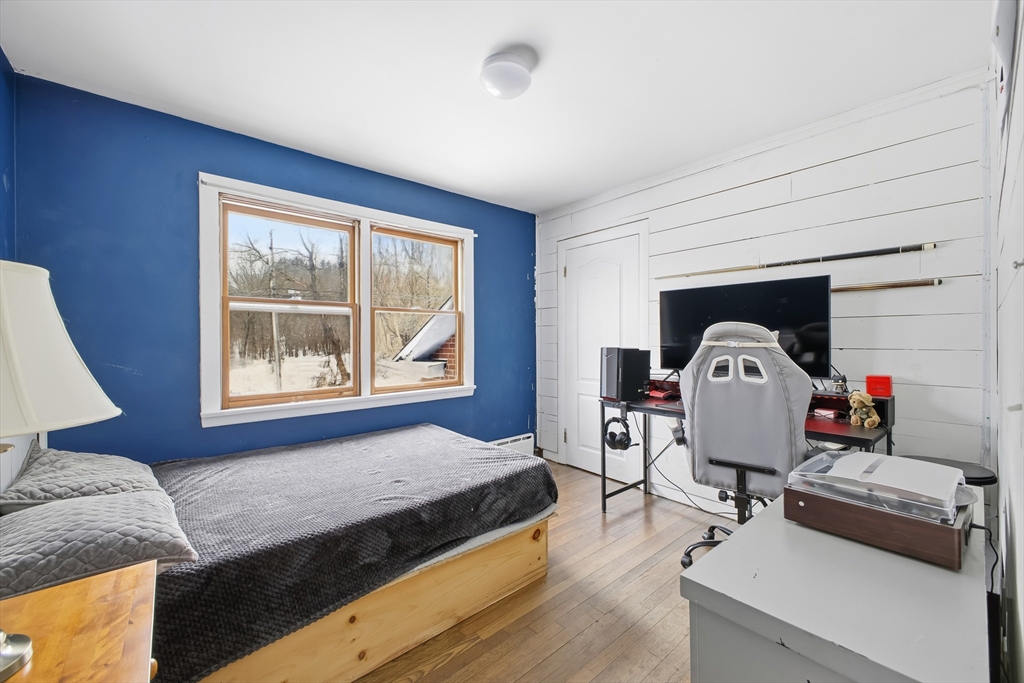 79 High Street Uxbridge, MA 01569 - Photo 17 of 35 a living room with furniture and a window