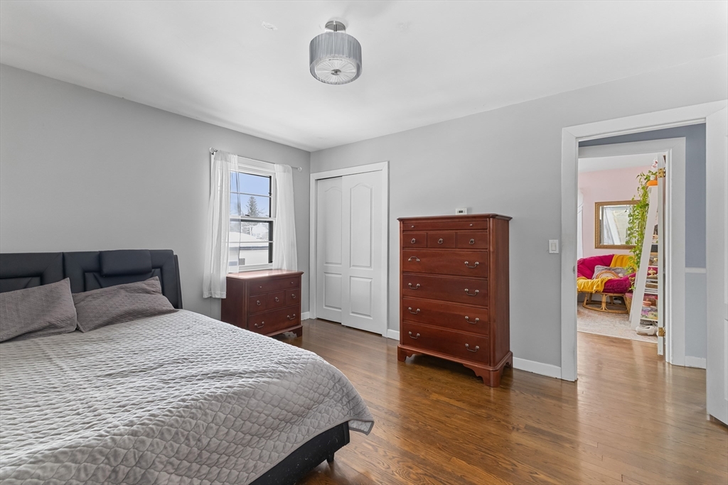 79 High Street Uxbridge, MA 01569 - Photo 20 of 35 a bedroom with a bed and wooden floor