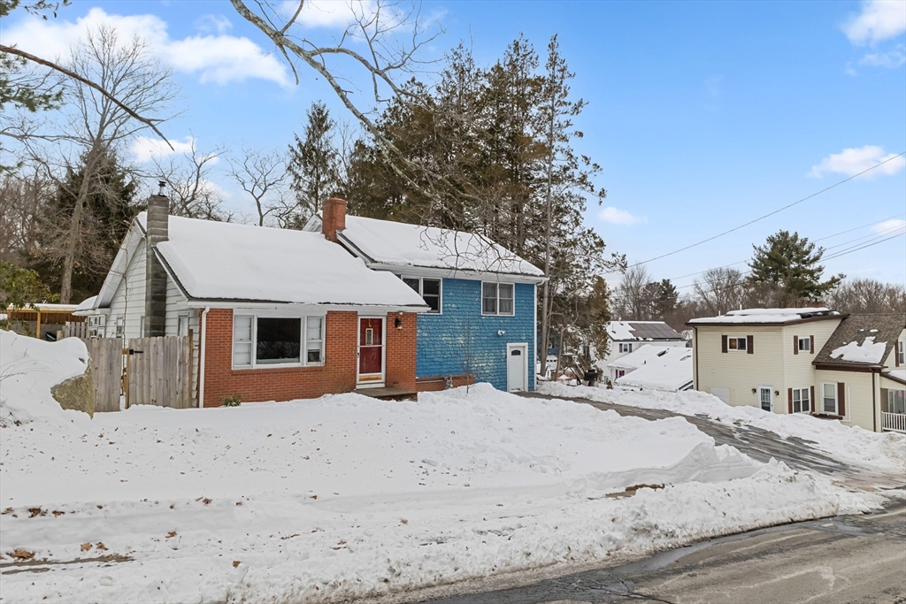 79 High Street Uxbridge, MA 01569 - Photo 2 of 35 a view of a white house with a yard
