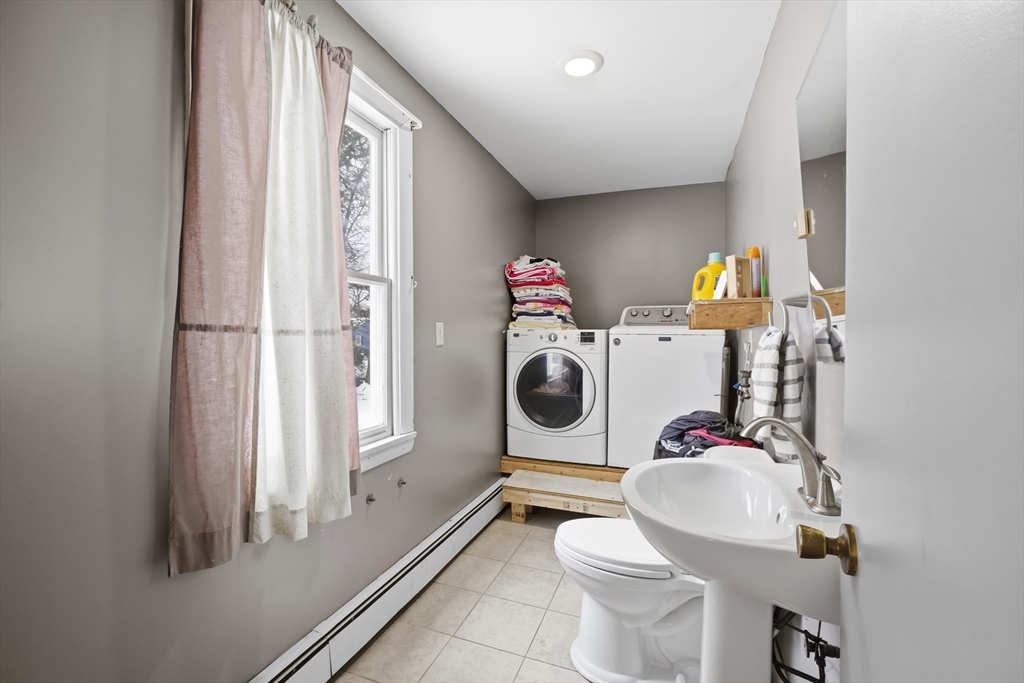 79 High Street Uxbridge, MA 01569 - Photo 21 of 35 a bathroom with a sink mirror and toilet