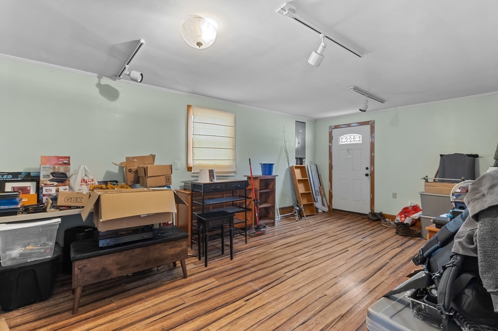 79 High Street Uxbridge, MA 01569 - Photo 22 of 35 a bedroom with furniture and a wooden floor