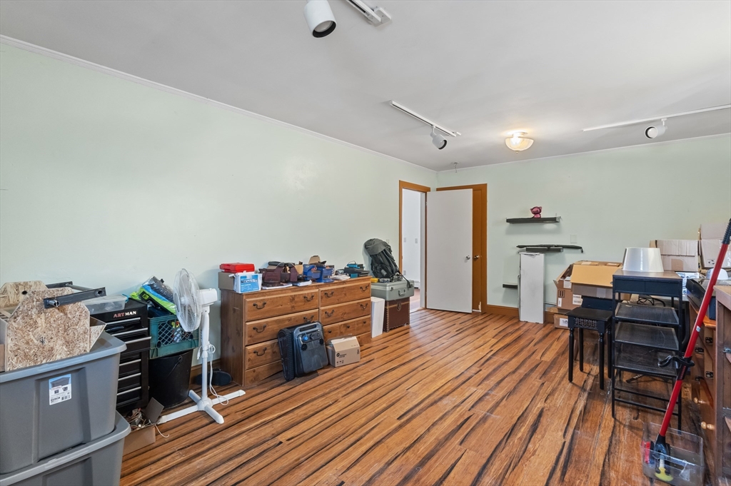 79 High Street Uxbridge, MA 01569 - Photo 23 of 35 a view of a workspace with furniture and wooden floor