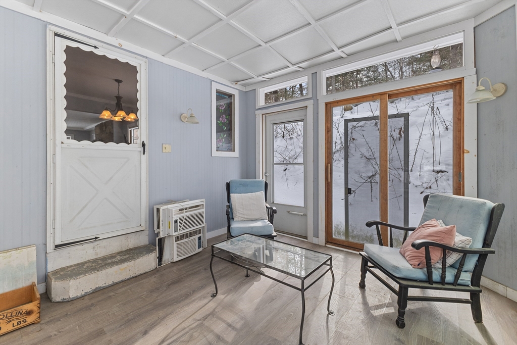 79 High Street Uxbridge, MA 01569 - Photo 25 of 35 a living room with furniture a rug and white walls