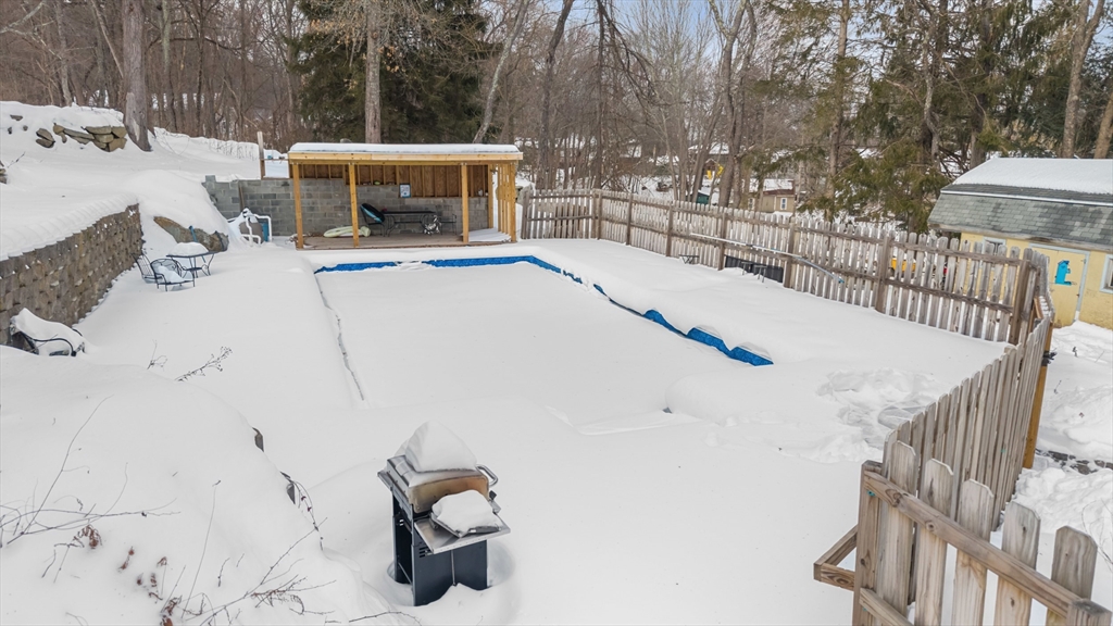 79 High Street Uxbridge, MA 01569 - Photo 26 of 35 a view of roof and deck with wooden fence