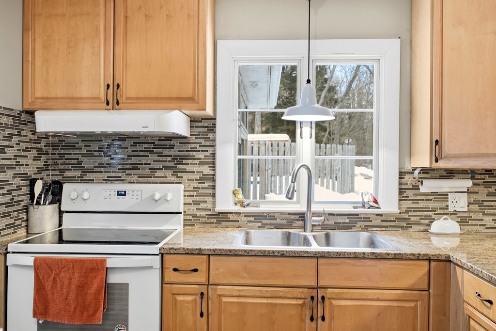 79 High Street Uxbridge, MA 01569 - Photo 3 of 35 a kitchen with stainless steel appliances granite countertop a sink and a cabinets