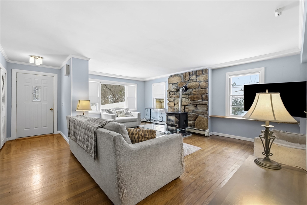 79 High Street Uxbridge, MA 01569 - Photo 10 of 35 a living room with furniture and a flat screen tv