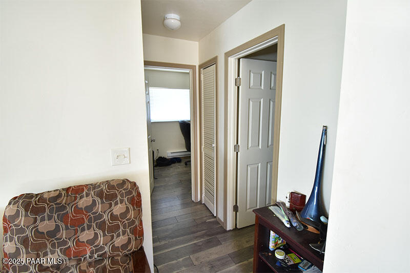 3200 North Victor Road Prescott Valley, AZ 86314 - Photo 17 of 30 a bedroom with a bed and wooden floor