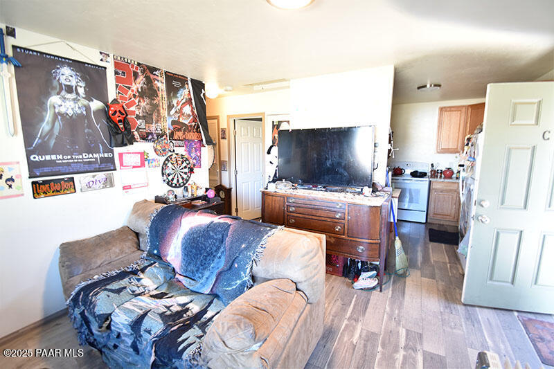 3200 North Victor Road Prescott Valley, AZ 86314 - Photo 21 of 30 a living room with furniture and a flat screen tv