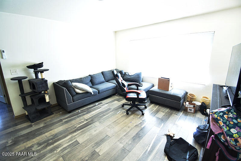 3200 North Victor Road Prescott Valley, AZ 86314 - Photo 7 of 30 a living room with furniture and a wooden floor