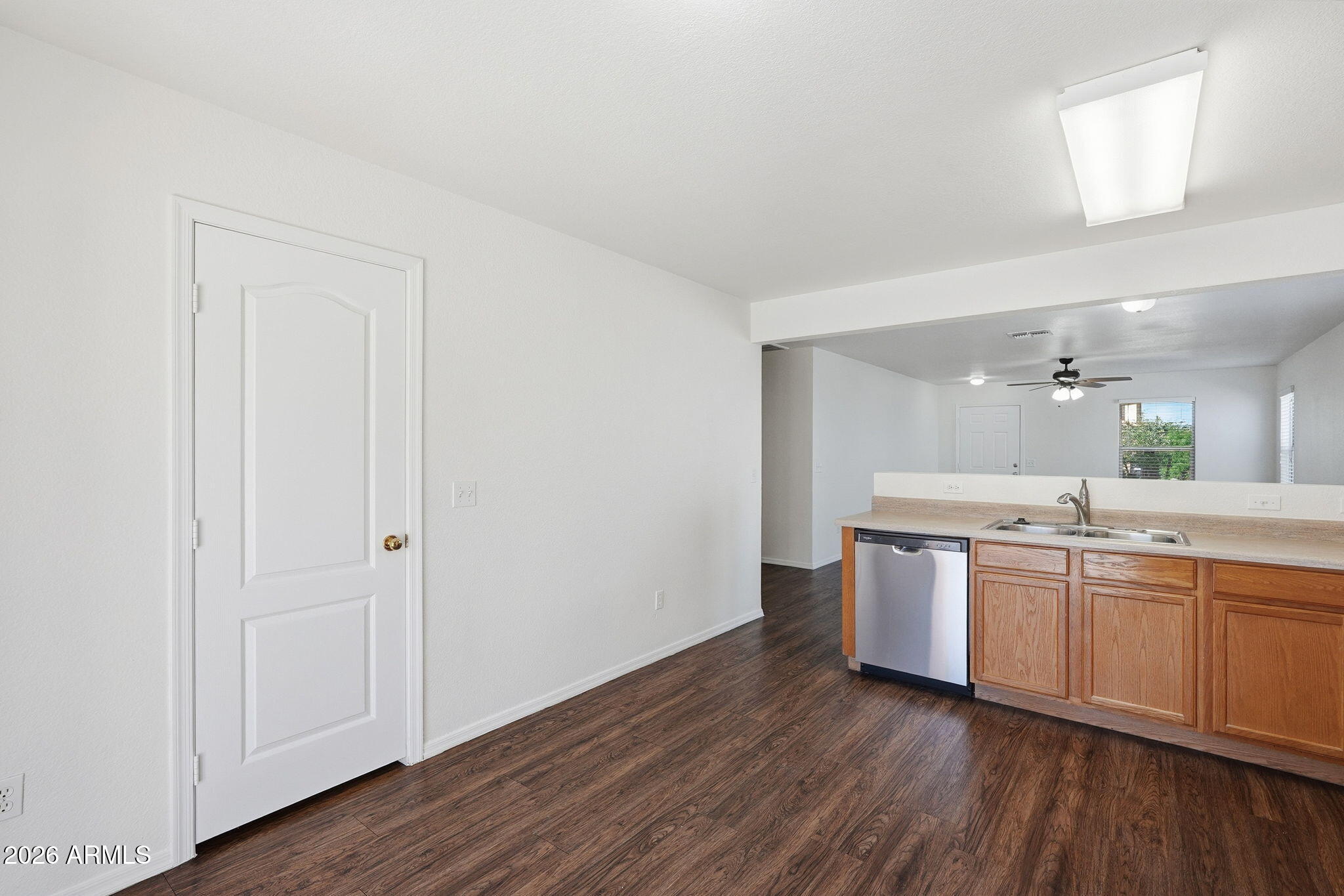 211 East Valley View Drive Phoenix, AZ 85042 - Photo 13 of 47 a kitchen with stainless steel appliances granite countertop a sink and wooden floor