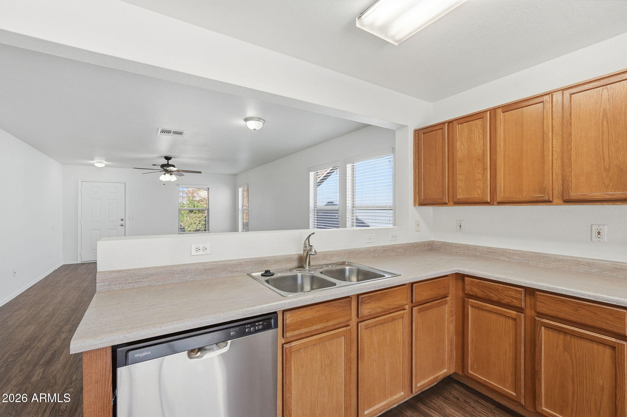 211 East Valley View Drive Phoenix, AZ 85042 - Photo 14 of 47 a kitchen with a sink cabinets and window