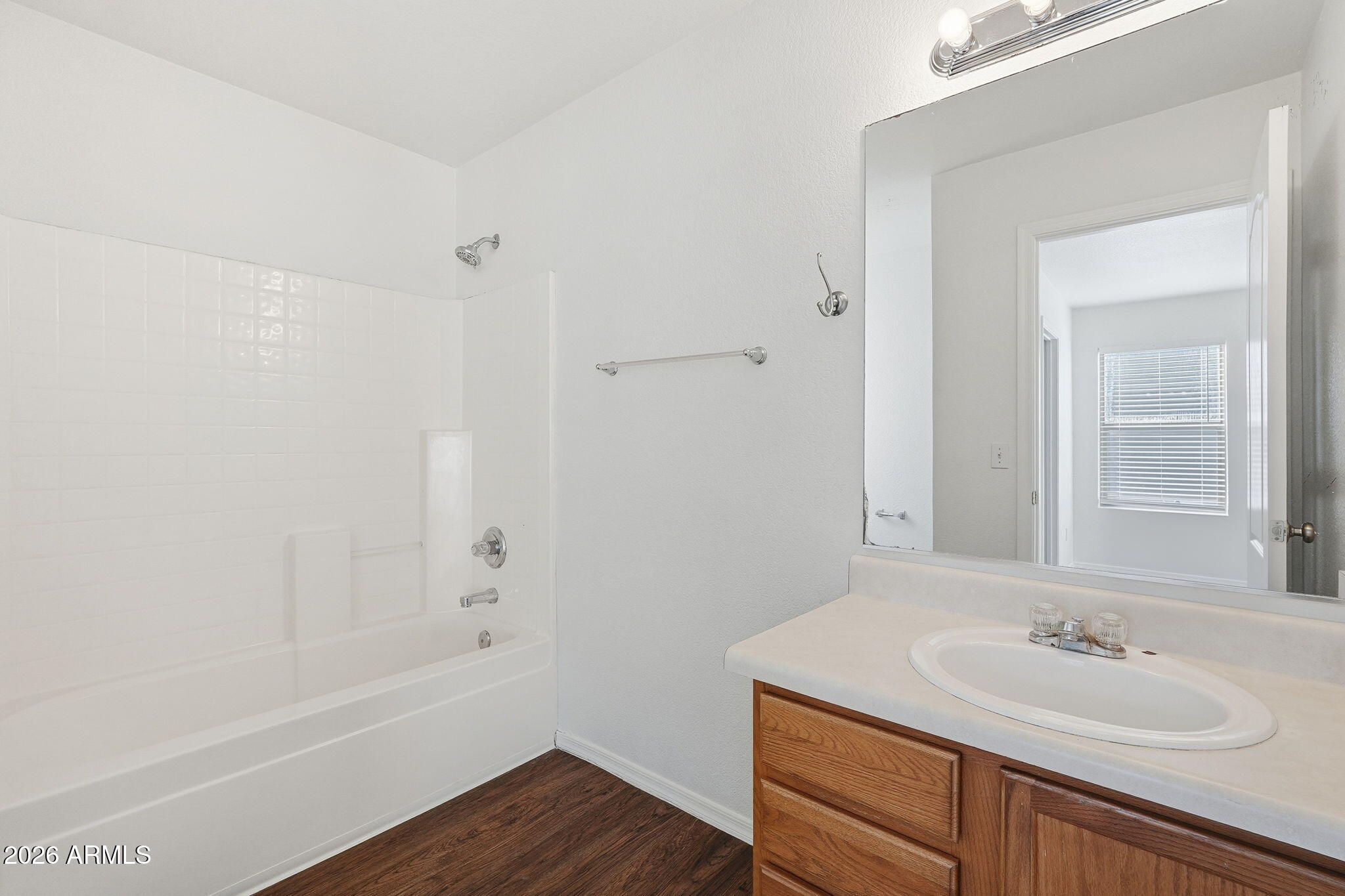 211 East Valley View Drive Phoenix, AZ 85042 - Photo 29 of 47 a bathroom with a sink and a mirror