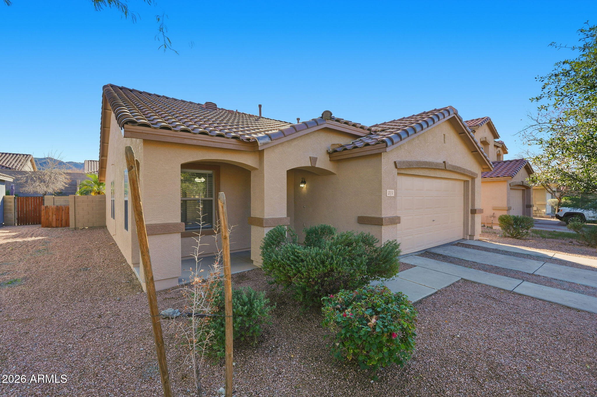 211 East Valley View Drive Phoenix, AZ 85042 - Photo 3 of 47 a view of a house with a small yard and floor to ceiling window