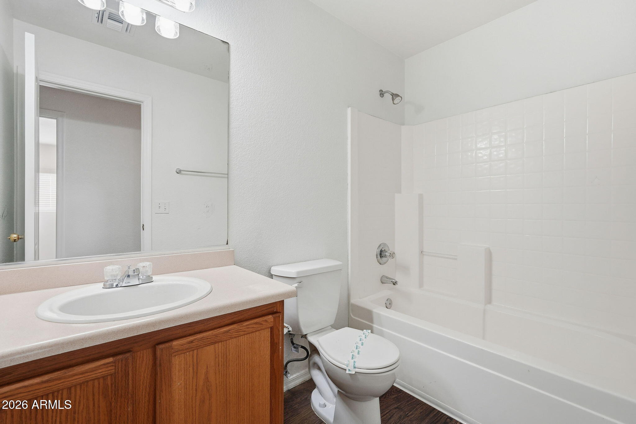 211 East Valley View Drive Phoenix, AZ 85042 - Photo 31 of 47 a bathroom with a sink toilet and shower