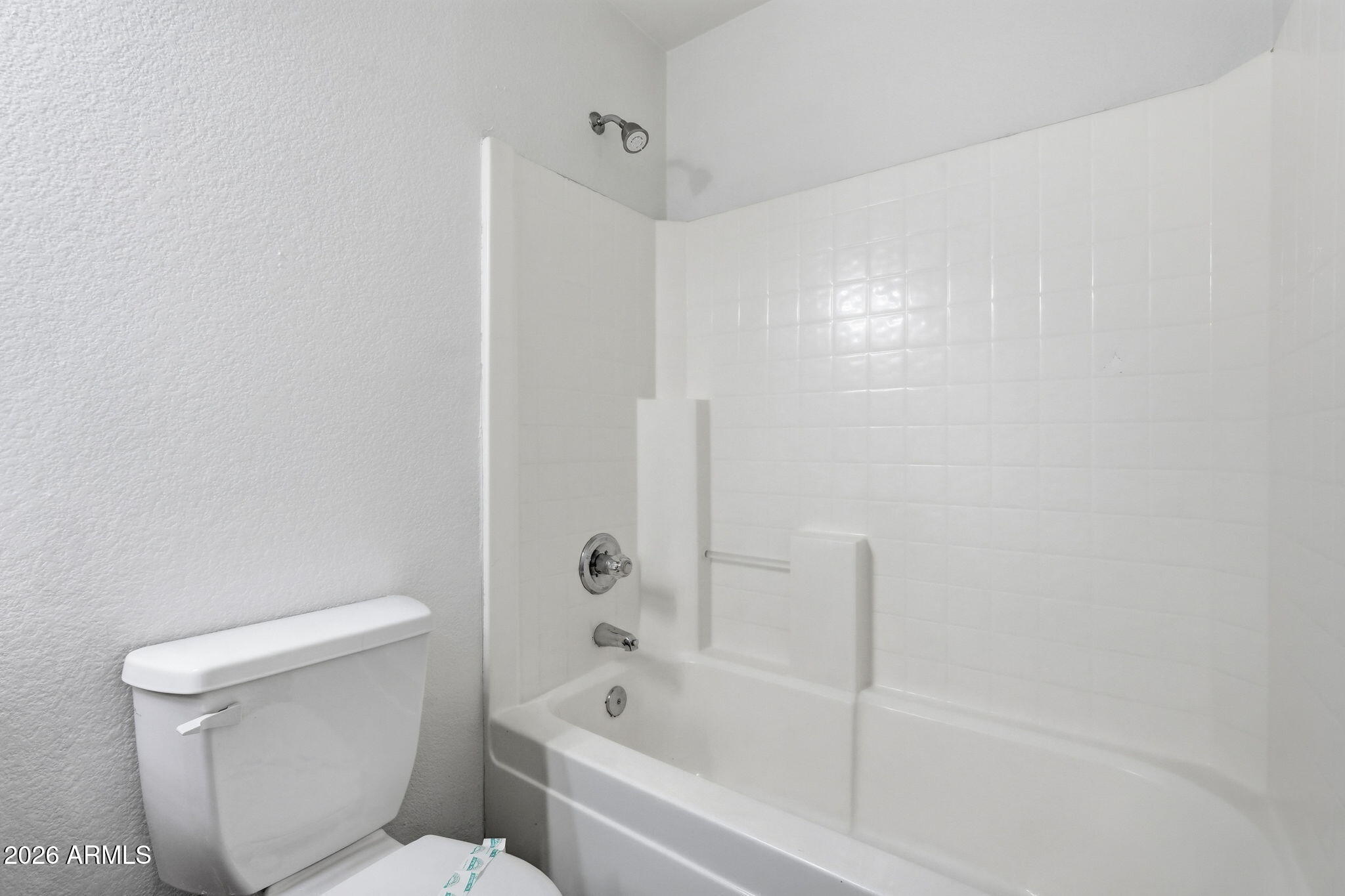 211 East Valley View Drive Phoenix, AZ 85042 - Photo 32 of 47 a bathroom with a toilet and a bathtub