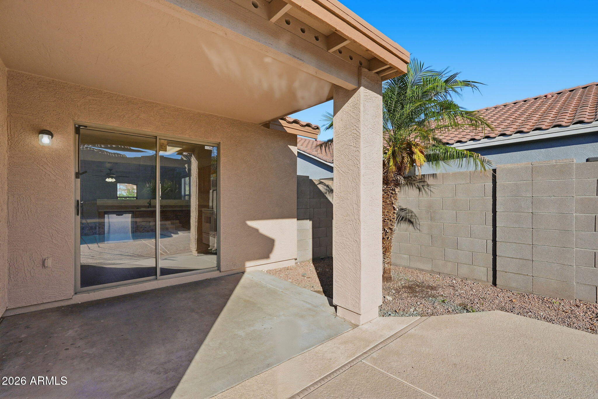 211 East Valley View Drive Phoenix, AZ 85042 - Photo 37 of 47 a view of a house with a glass door and glass door