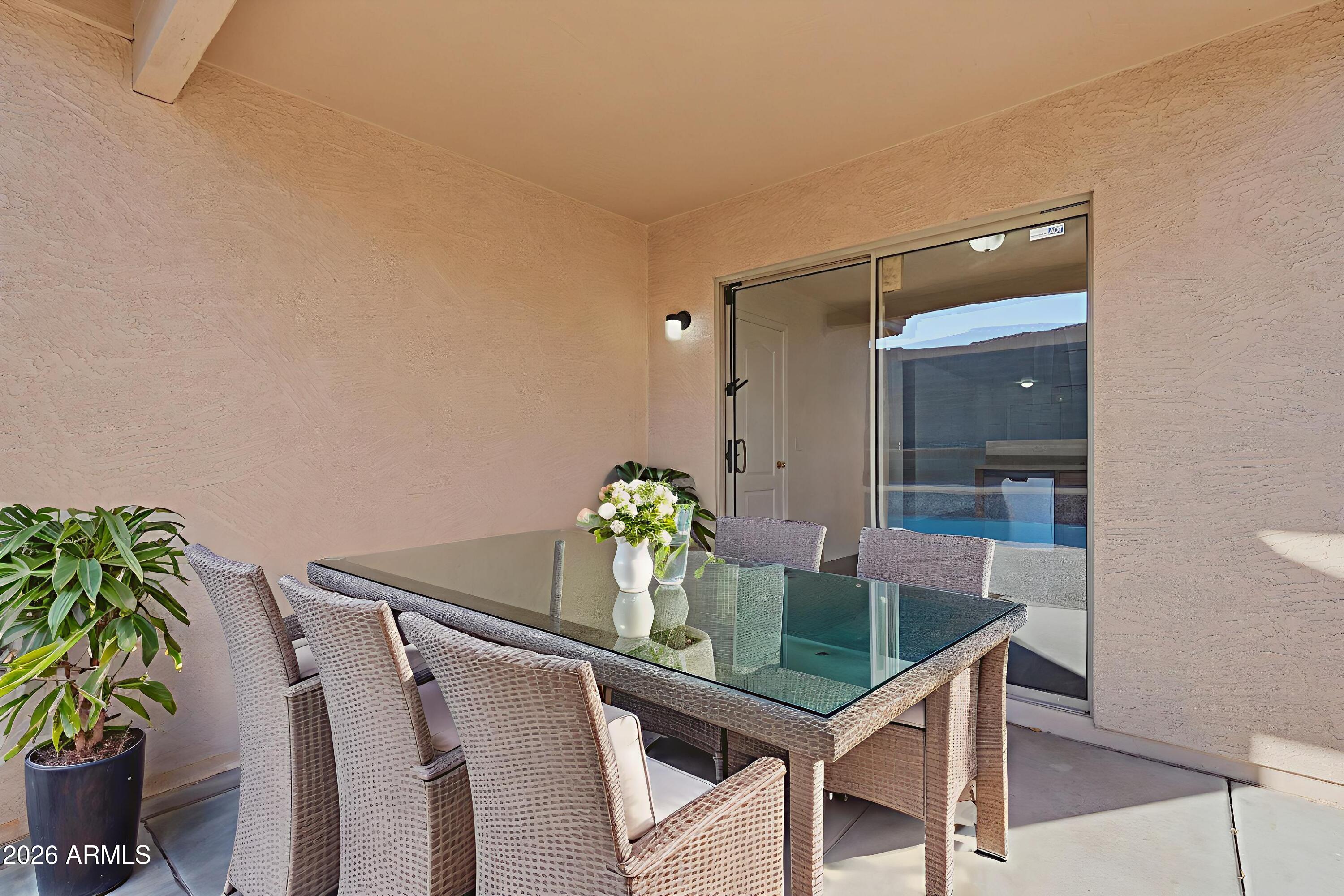 211 East Valley View Drive Phoenix, AZ 85042 - Photo 39 of 47 a dining room with furniture and potted plants