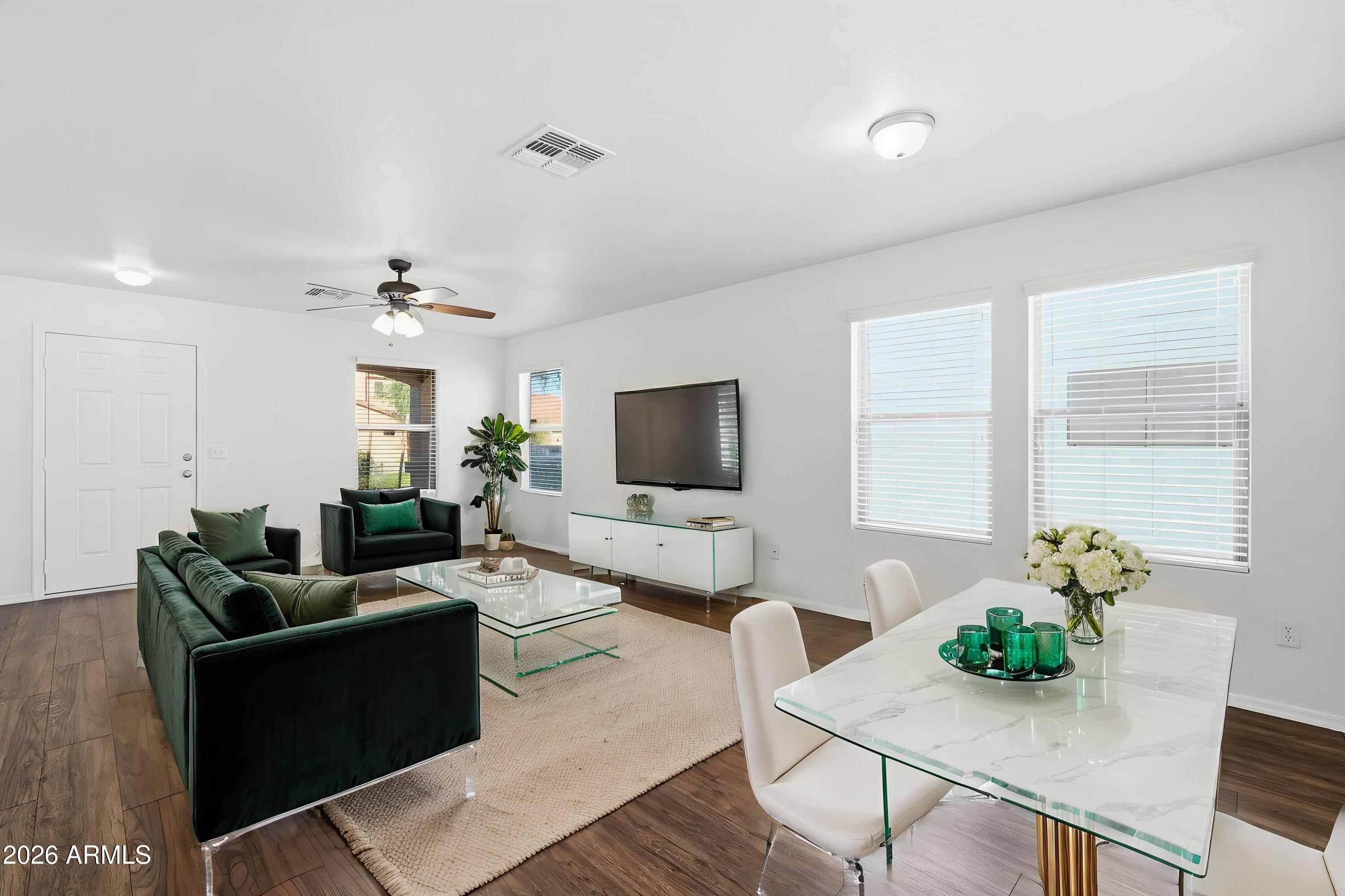 211 East Valley View Drive Phoenix, AZ 85042 - Photo 5 of 47 a living room with furniture potted plant and a window