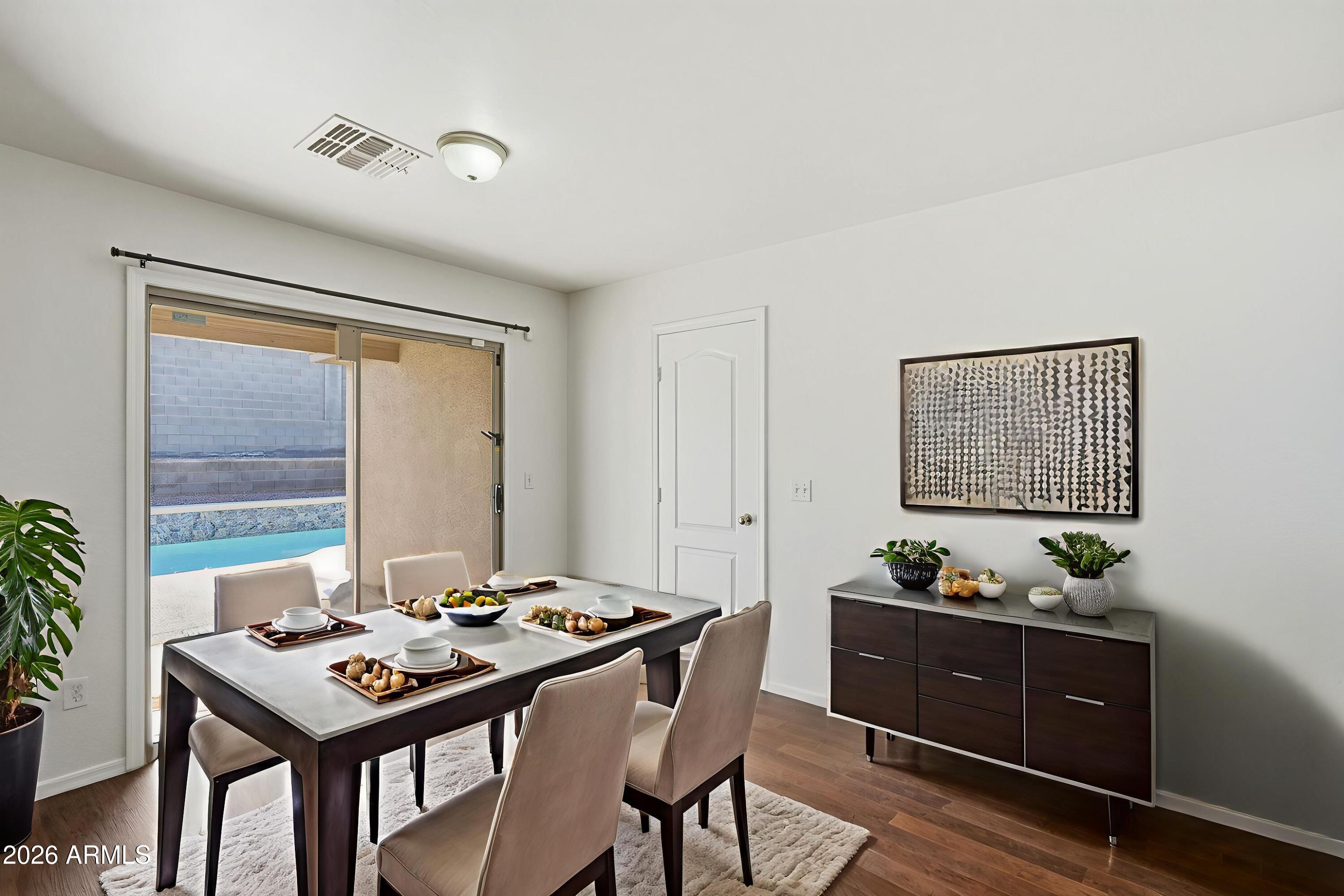211 East Valley View Drive Phoenix, AZ 85042 - Photo 6 of 47 a view of a dining room with furniture and window
