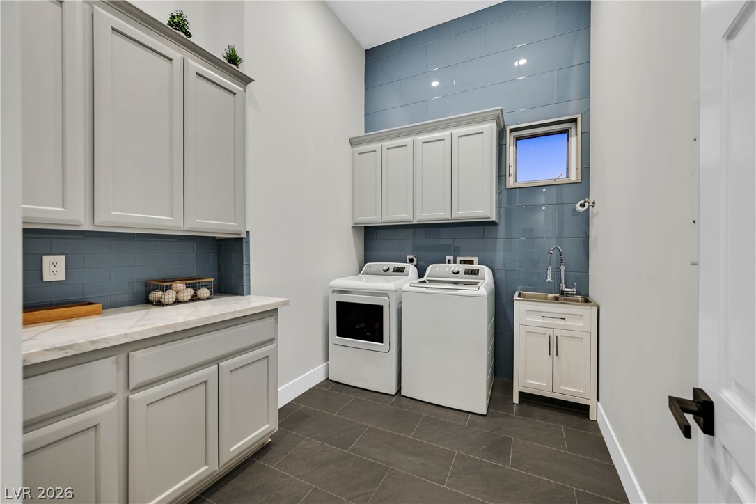 6 Rue Du Ville Henderson, NV 89011 - Photo 70 of 99 This thoughtfully designed laundry room offers convenience and ample storage for daily tasks.