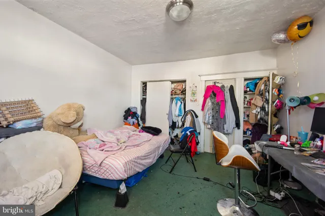 a bed room with a bed and a table