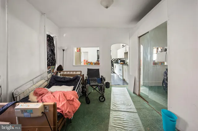 a bed room with a bed and a mirror