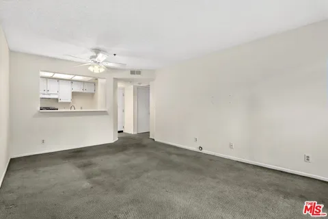 a kitchen with a sink and a refrigerator