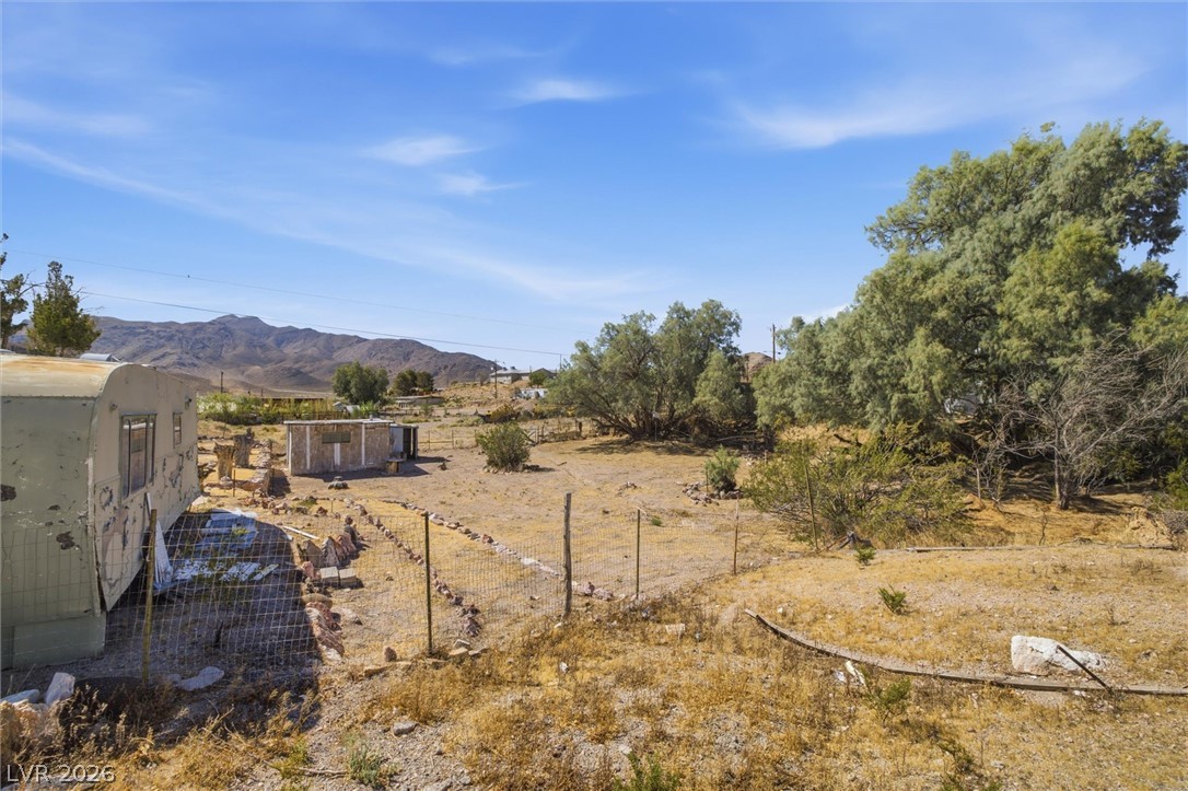 405 Main Street Beatty, NV 89003 - Photo 15 of 28 A desert oasis with distant mountains offers a secluded living opportunity.