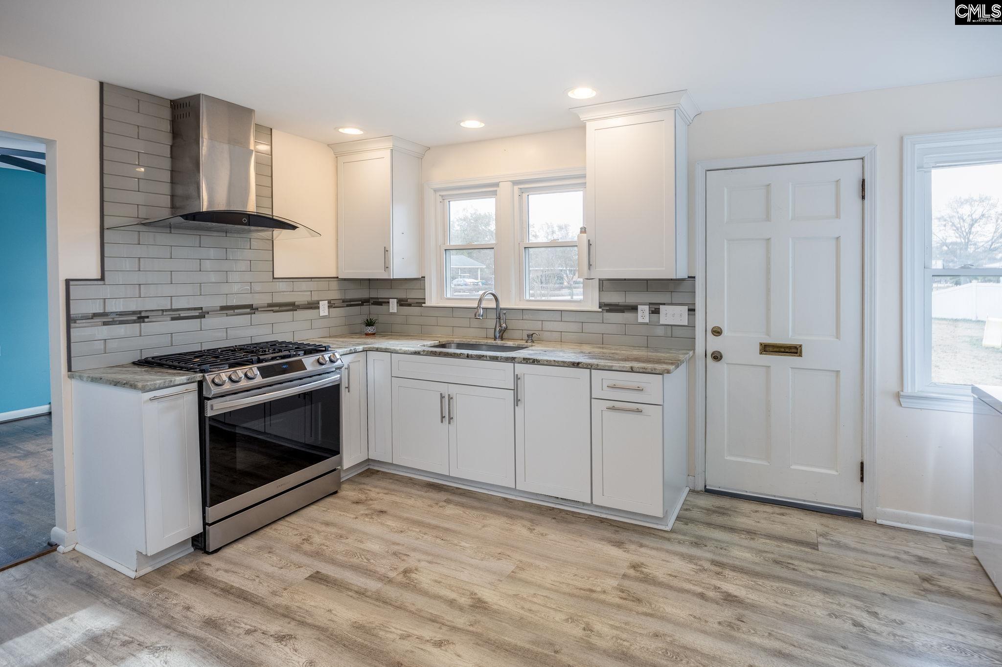 560 Edisto Street Batesburg, SC 29006 - Photo 6 of 49 a kitchen with a stove oven and sink