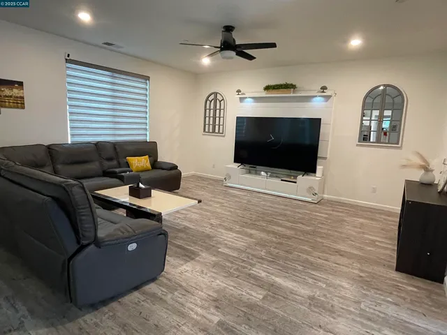 a kitchen with stainless steel appliances granite countertop a sink a refrigerator and a granite counter tops