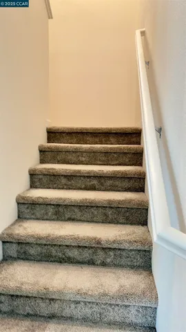a room with furniture and a computer on a desk
